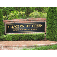 Village On The Green logo