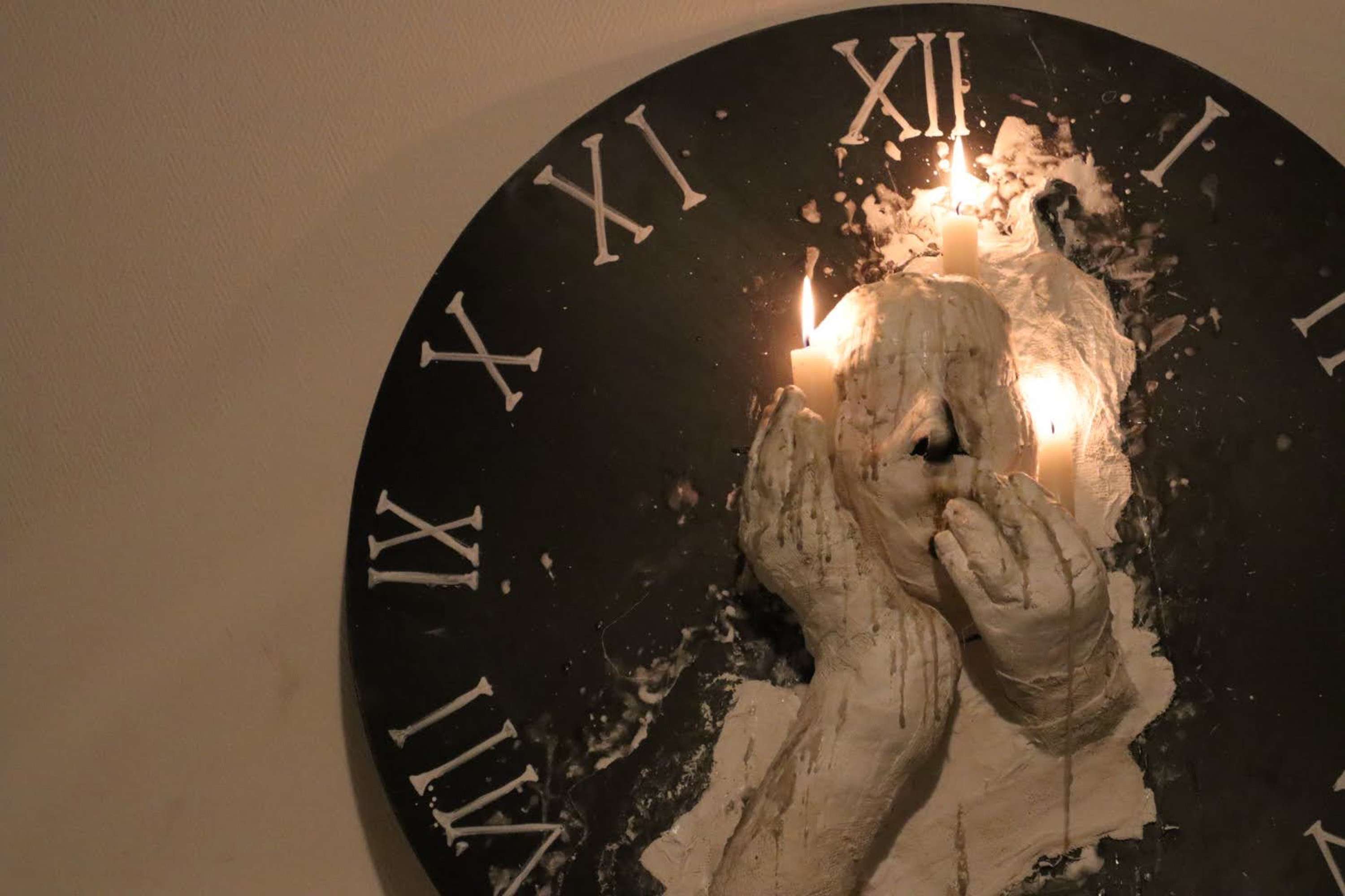 'Melting Man on a Roman Numeral Clock' by Ayoor Wassagou