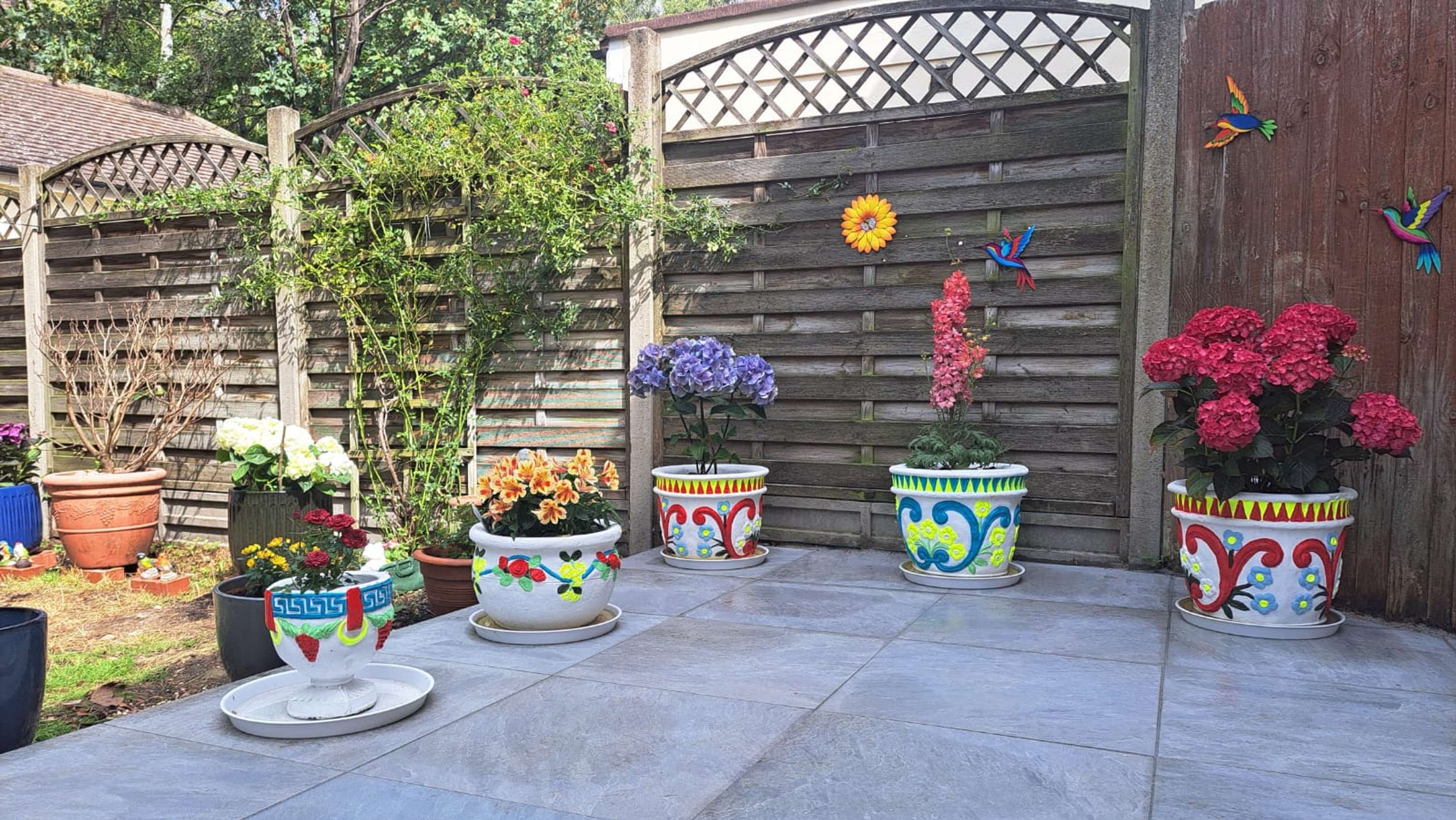 From Trash to Treasure; Transformation of Flower Pots by Evie Anderson