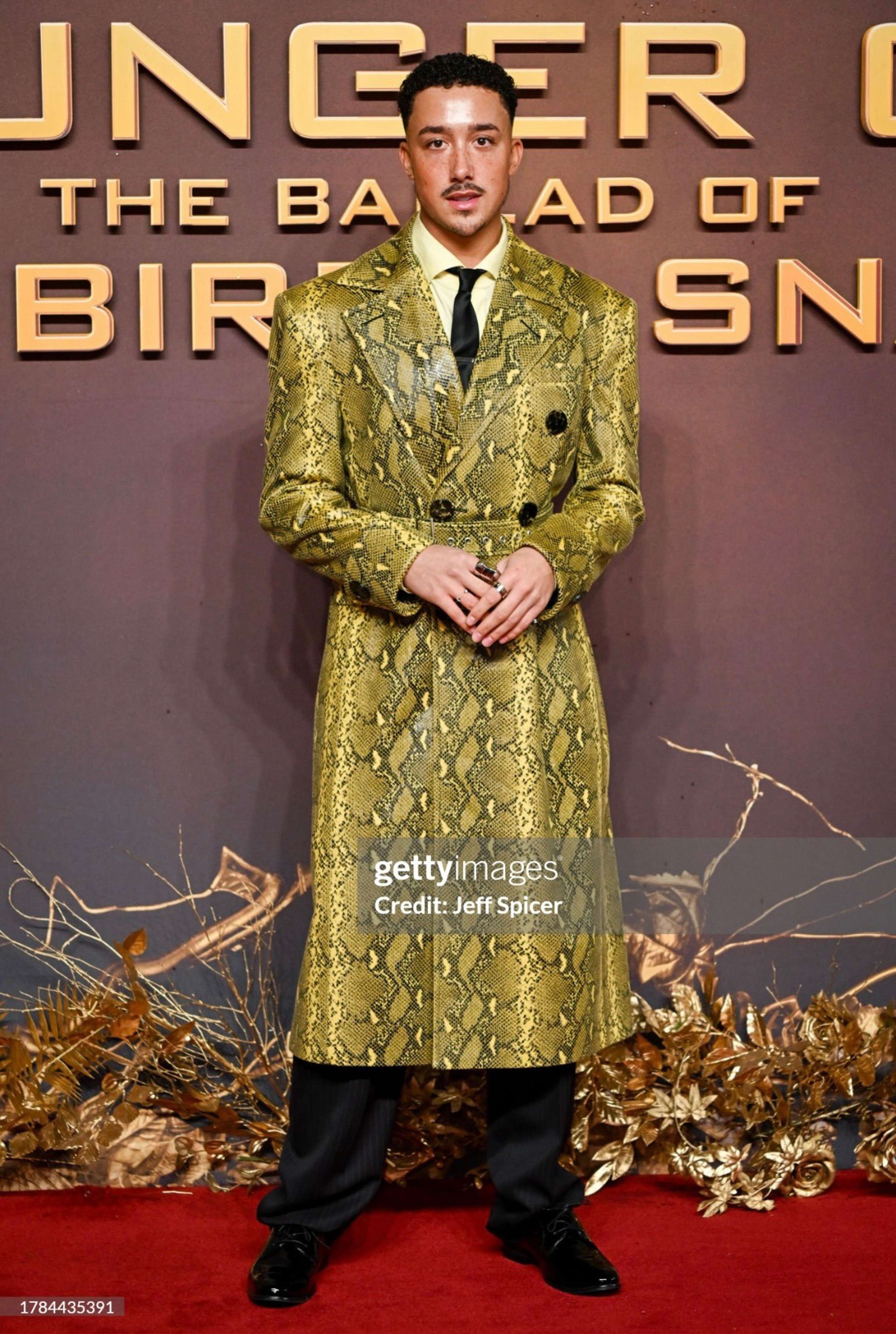 Kyron Hamilton in custom look for Hunger Games Premiere by Josh Arimoro